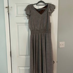 Vneck Dress with a brown and cream color and a  ruffle sleeve